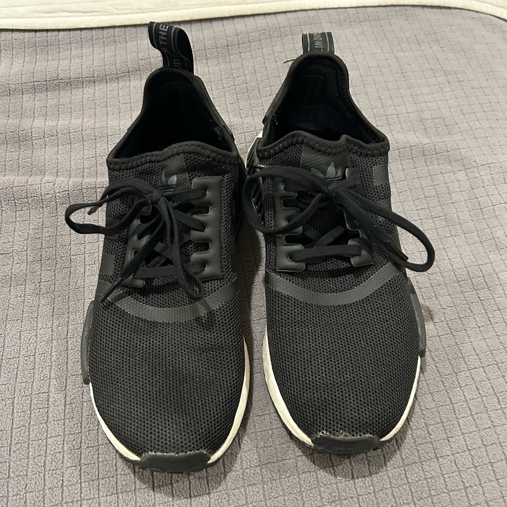 Black and white NMD adidas sneakers